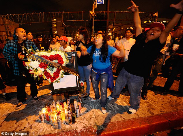 Demonstrators at a makeshift memorial to Manuel Jamines on September 8, 2010 in Los Angeles, California